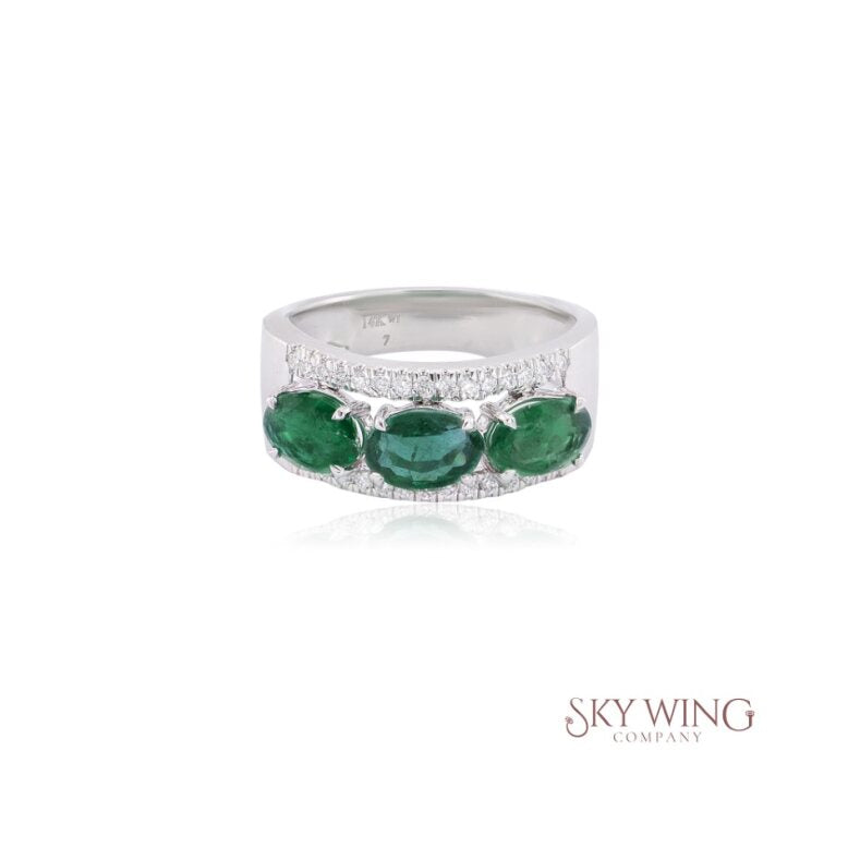 EMERALD AND ROUND DIAMOND RING