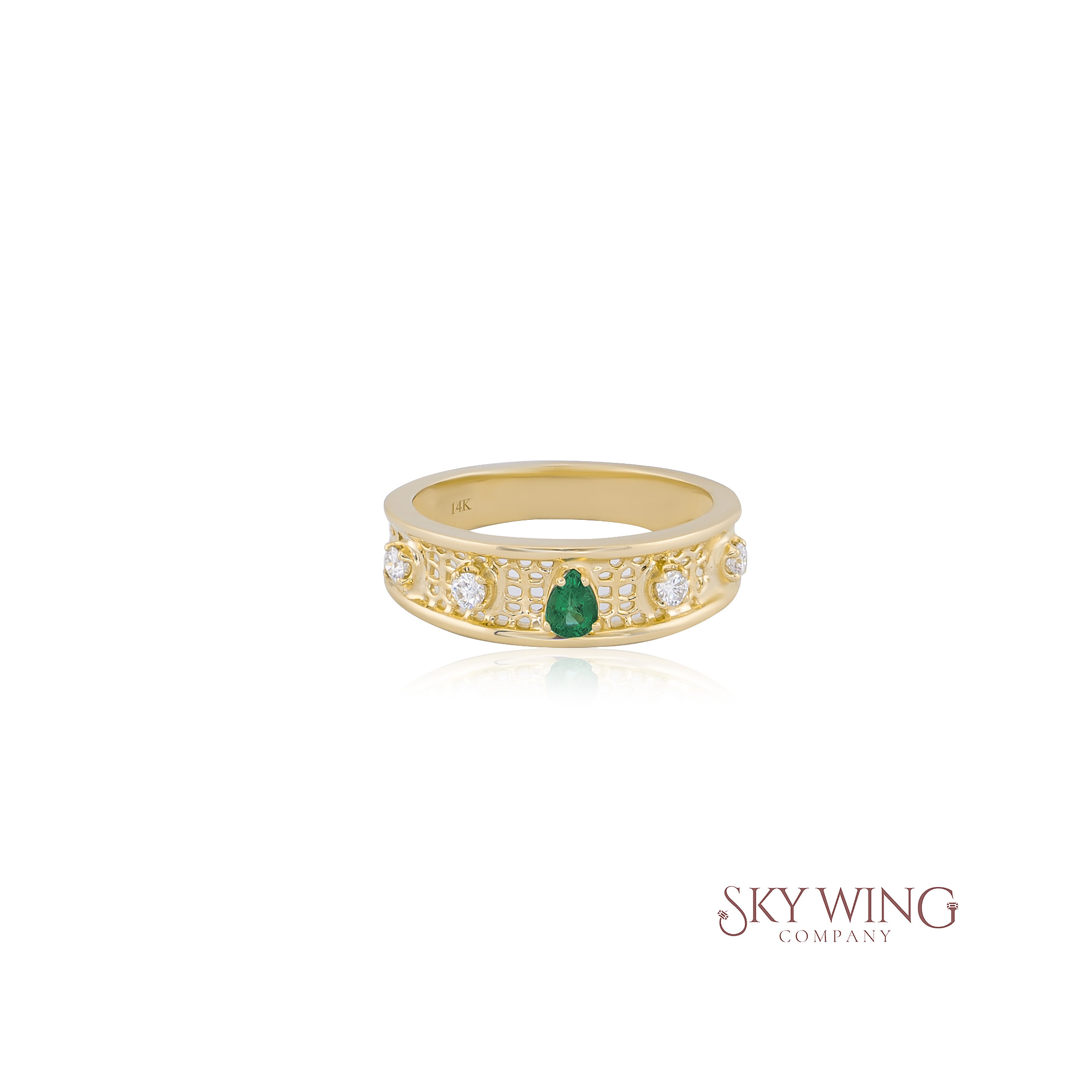 PEAR SHAPED EMERALD AND ROUND DIAMOND RING