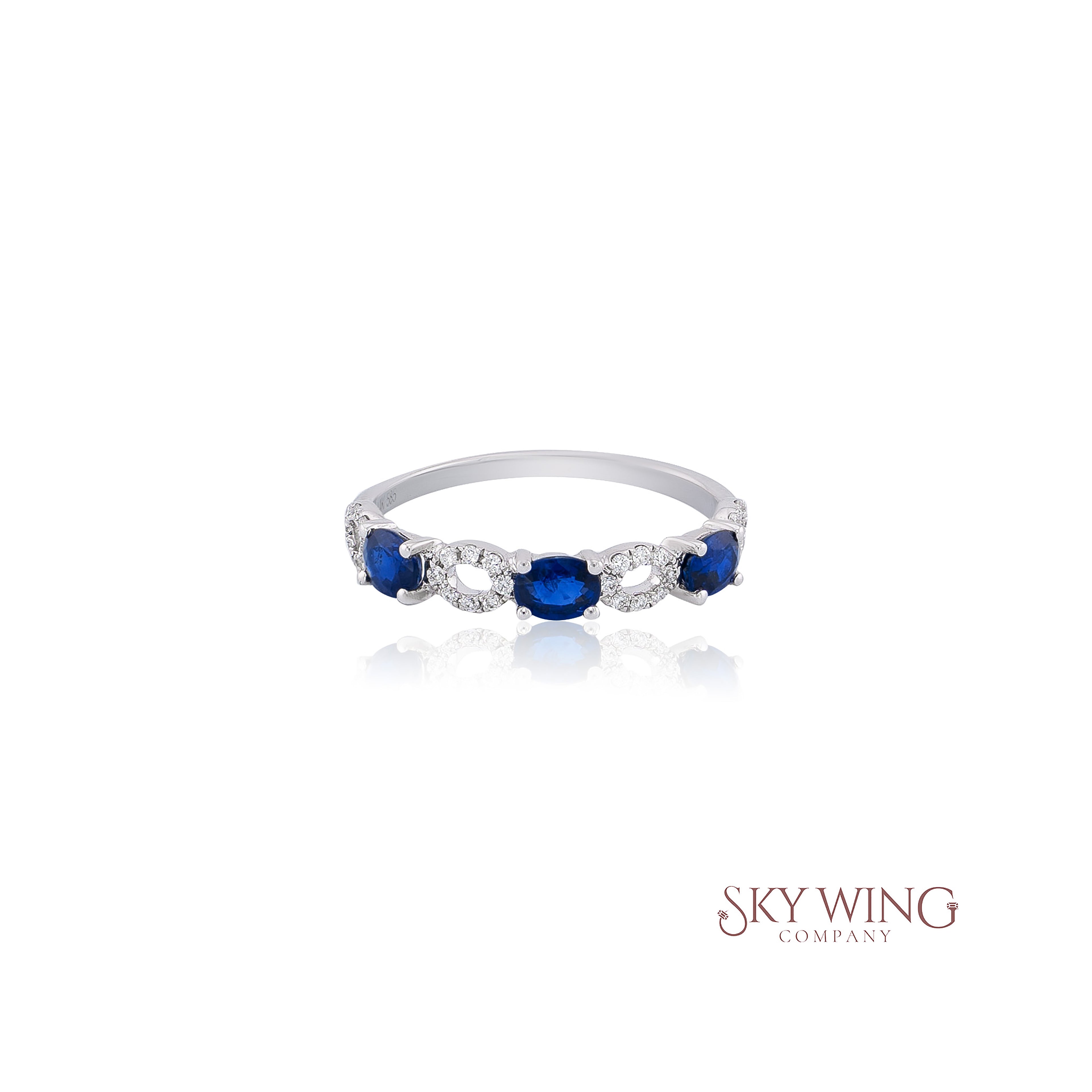 3 STONE OVAL BLUE SAPPHIRE AND ROUND DIAMOND RING