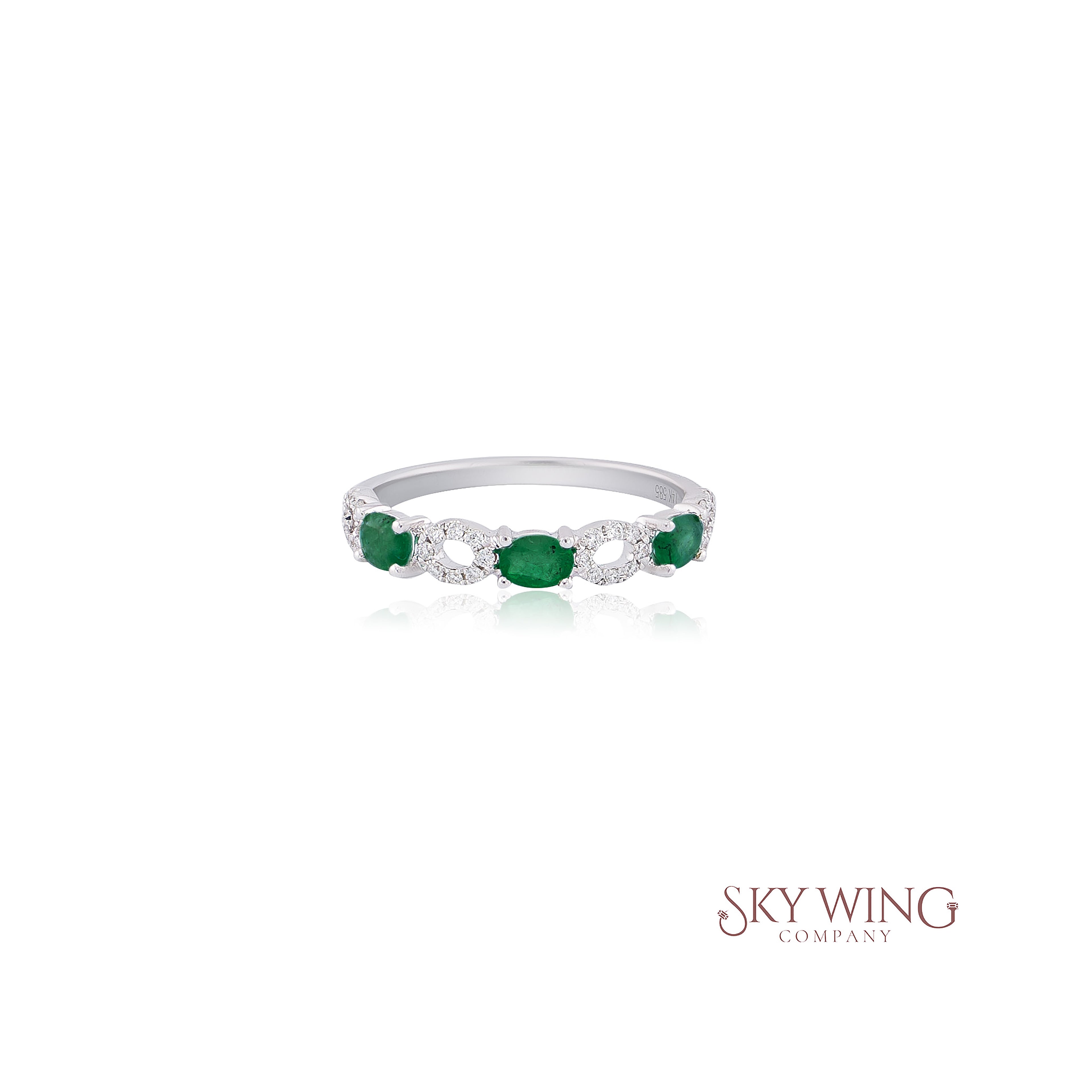 3 STONE OVAL EMERALD AND ROUND DIAMOND RING