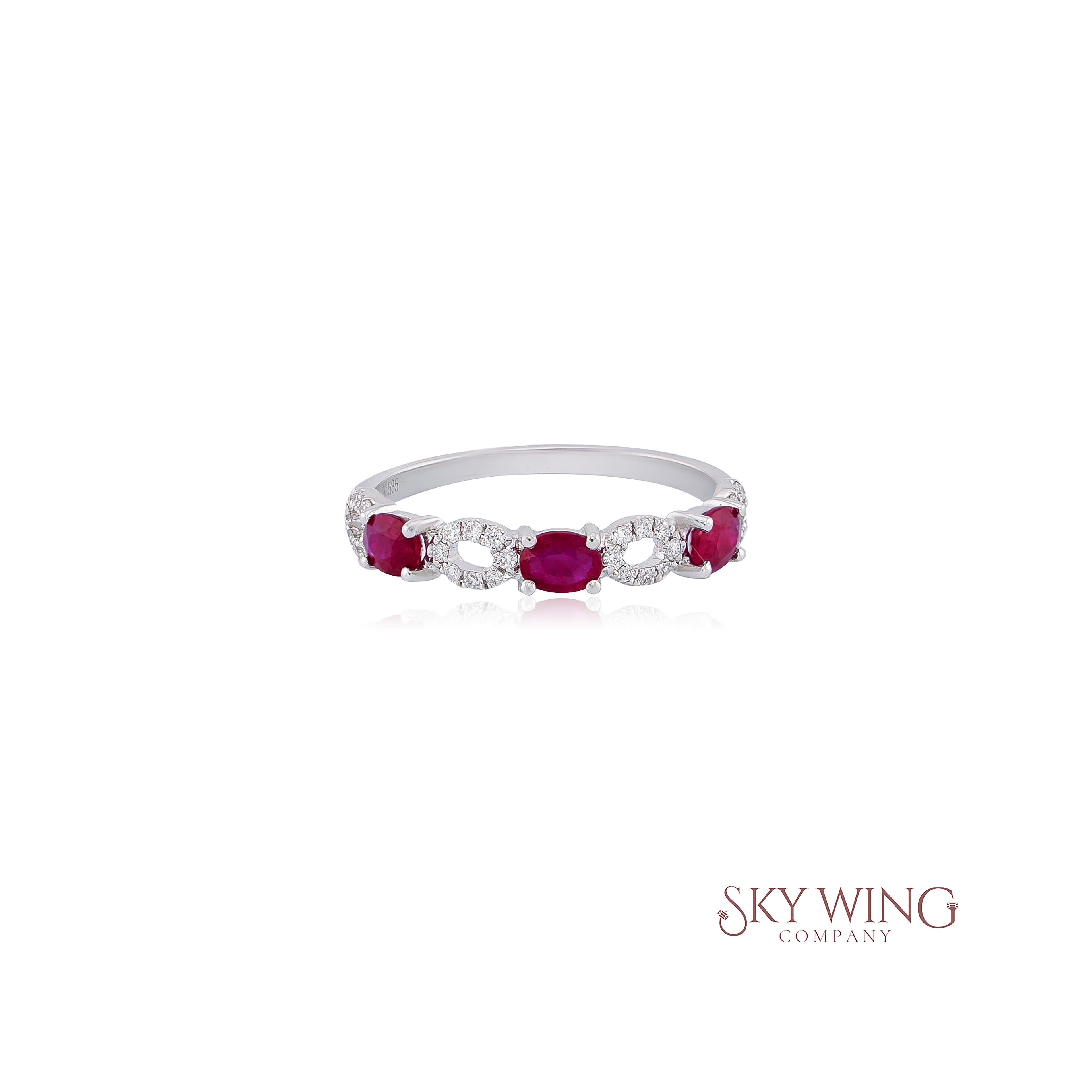3 STONE OVAL RUBY AND ROUND DIAMOND RING
