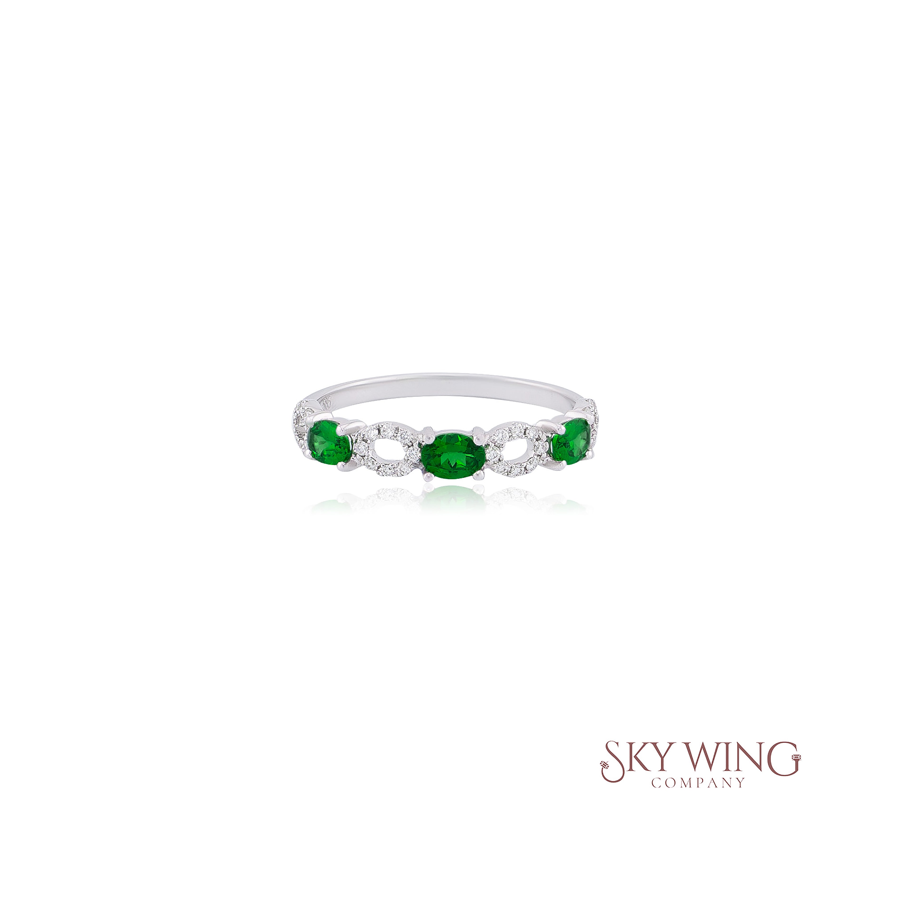 3 STONE OVAL TSAVORITE AND ROUND DIAMOND RING
