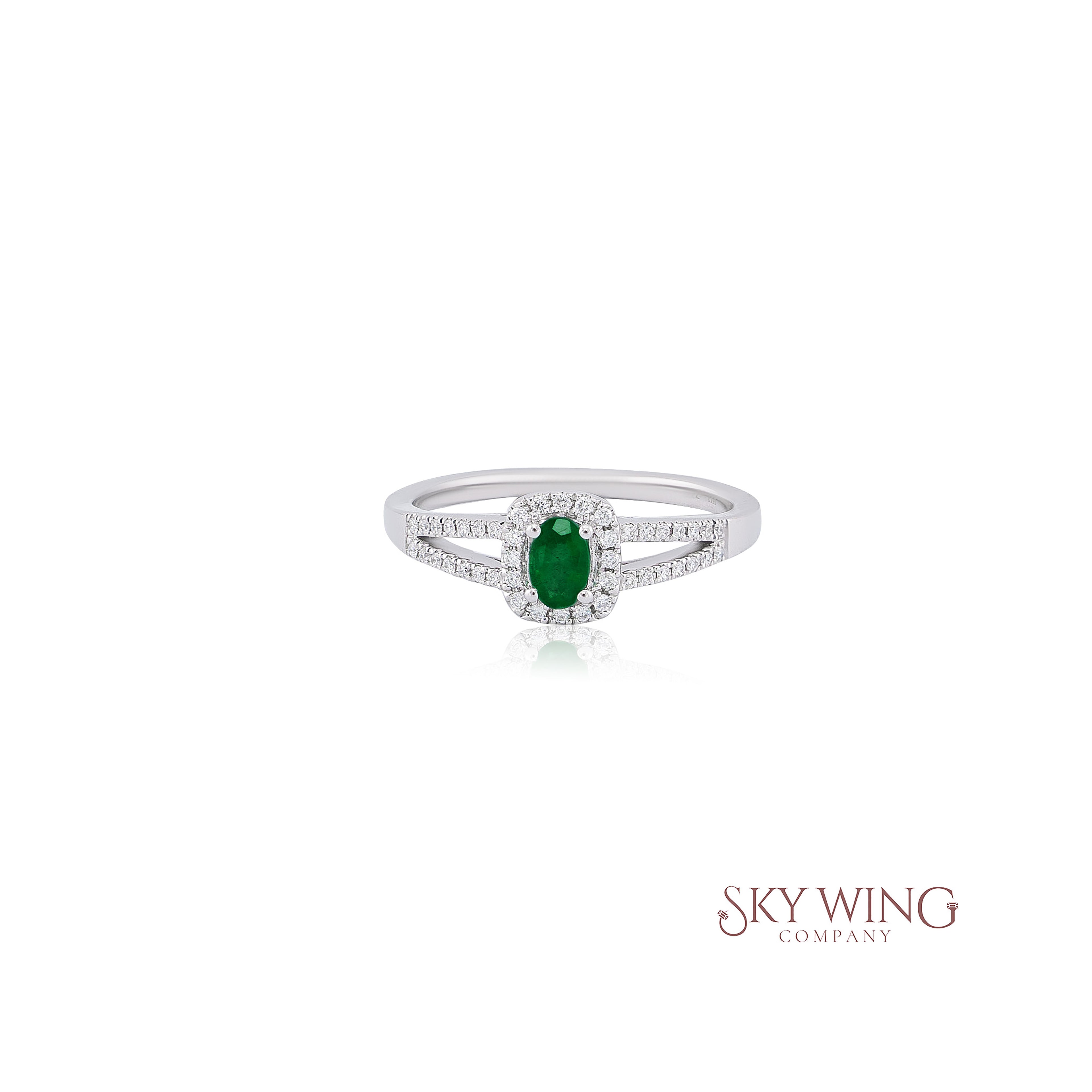 OVAL EMERALD & ROUND DIAMOND RING