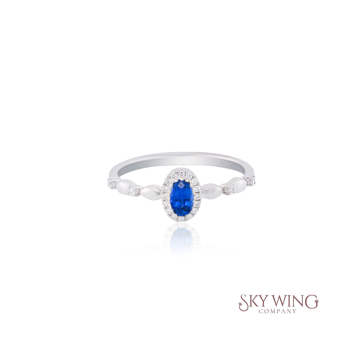 OVAL BLUE SAPPHIRE AND ROUND DIAMOND RING