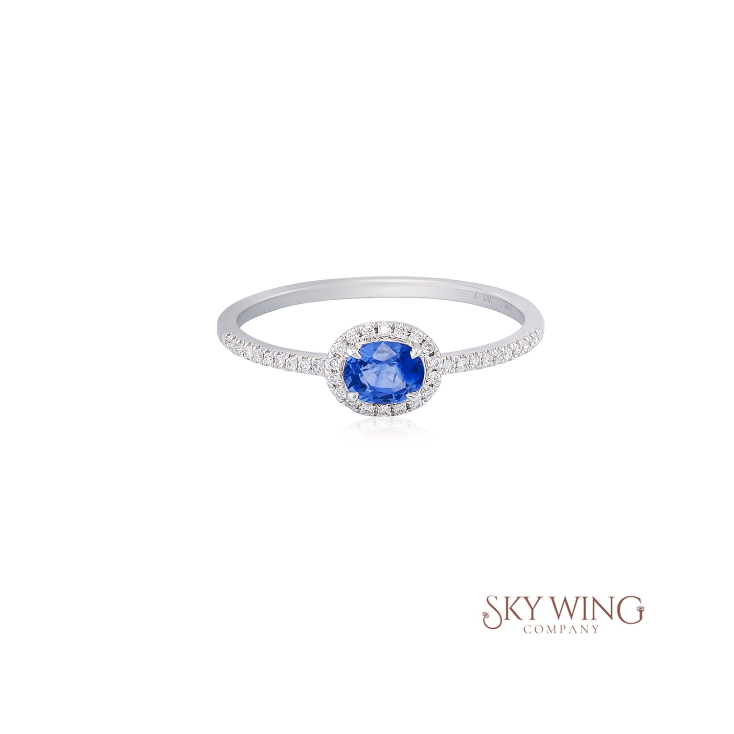 OVAL BLUE SAPPHIRE AND ROUND DIAMOND RING