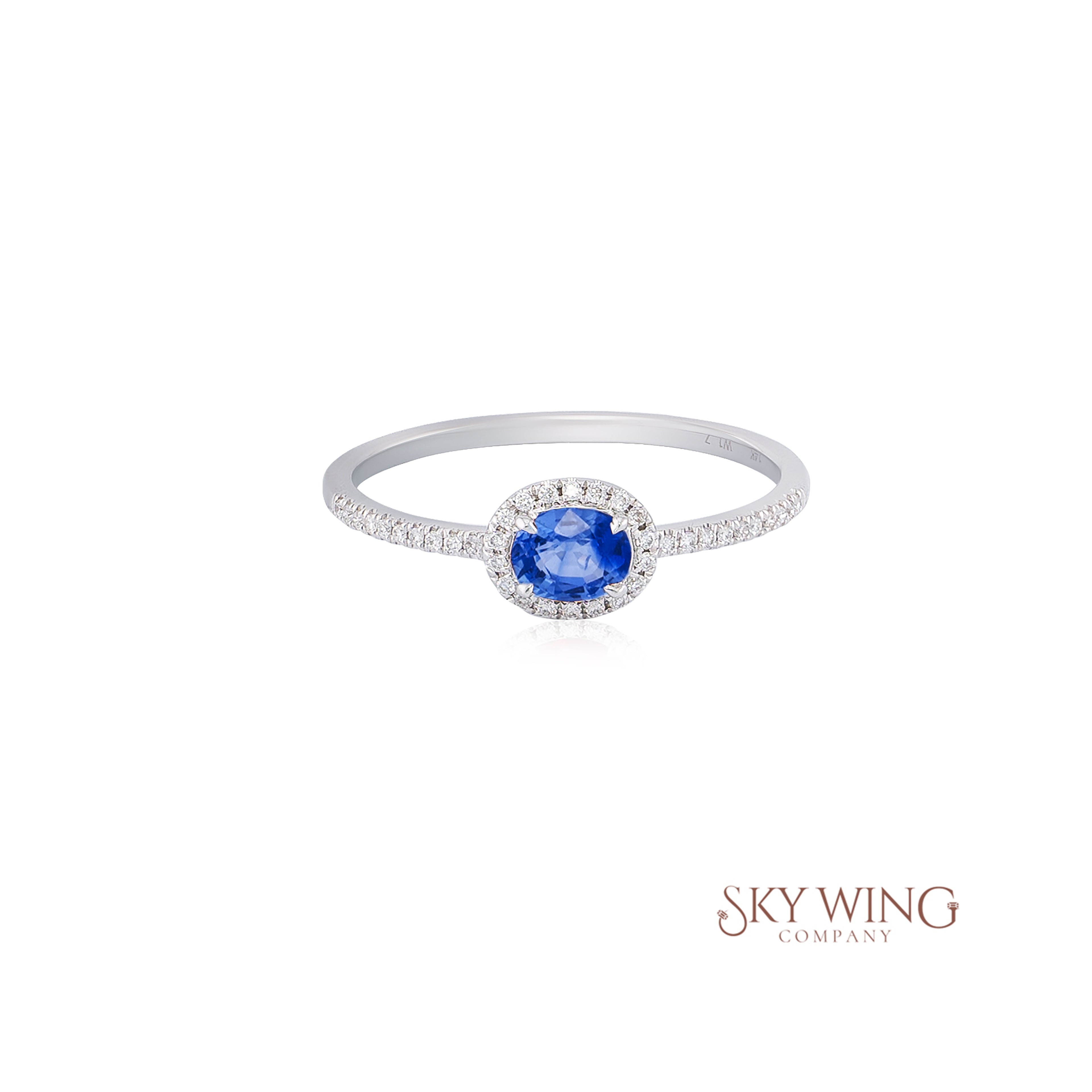 OVAL BLUE SAPPHIRE AND ROUND DIAMOND RING