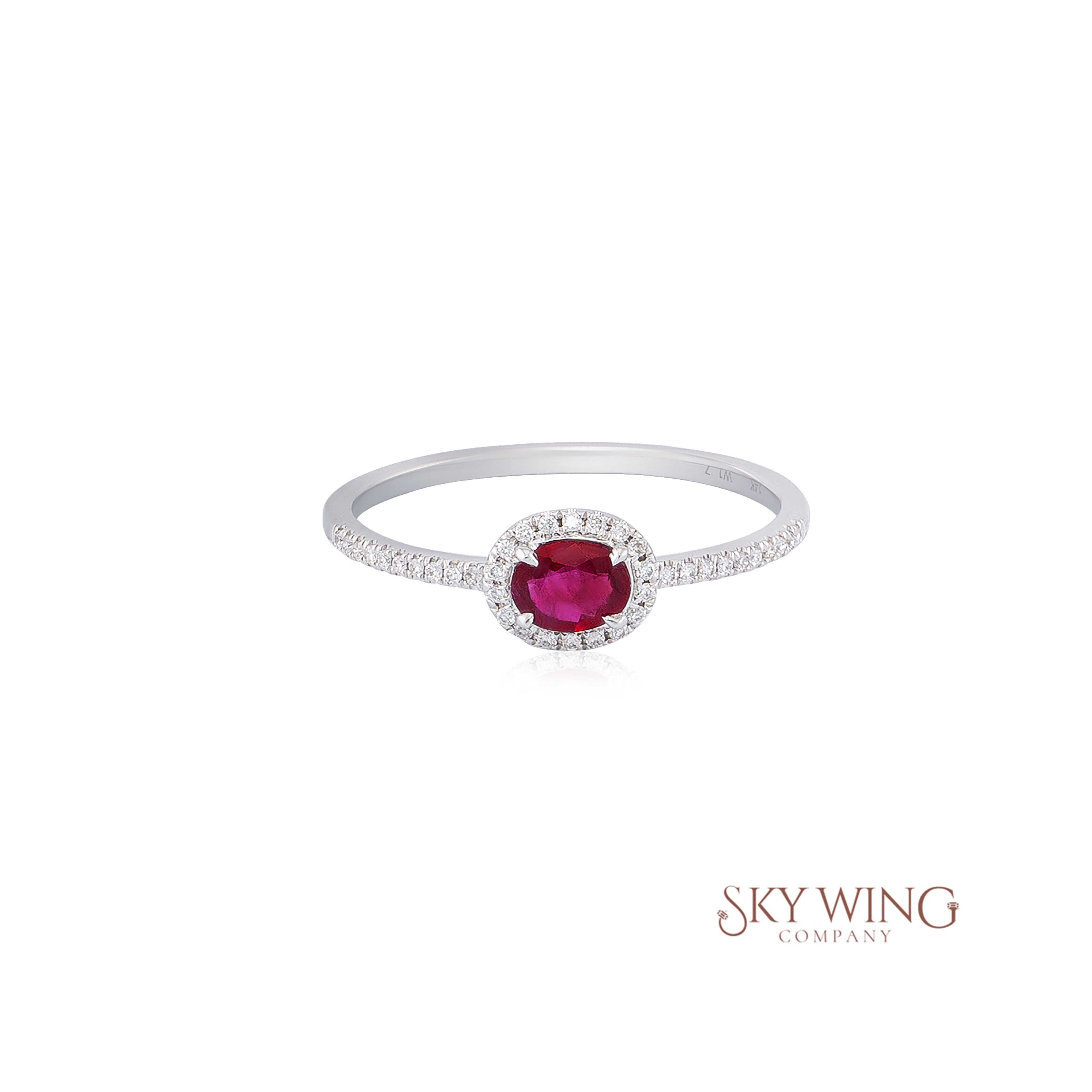 OVAL RUBY AND ROUND DIAMOND RING
