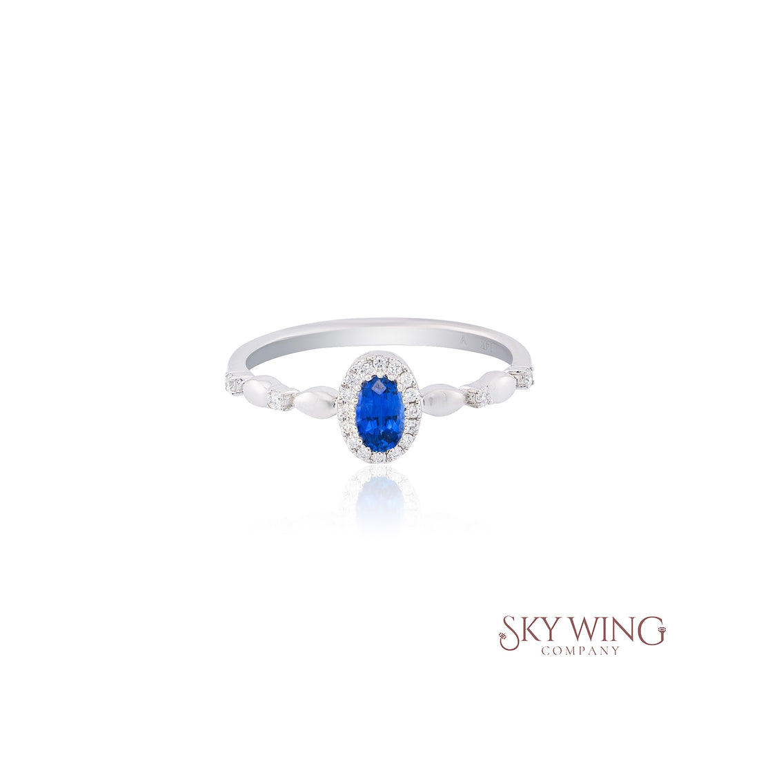 OVAL BLUE SAPPHIRE AND ROUND DIAMOND RING