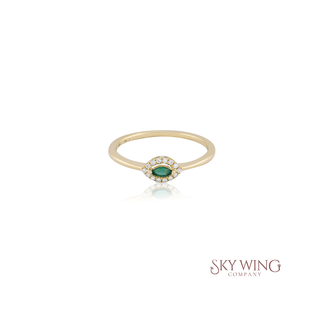 EMERALD MARQUISE AND ROUND DIAMOND RING