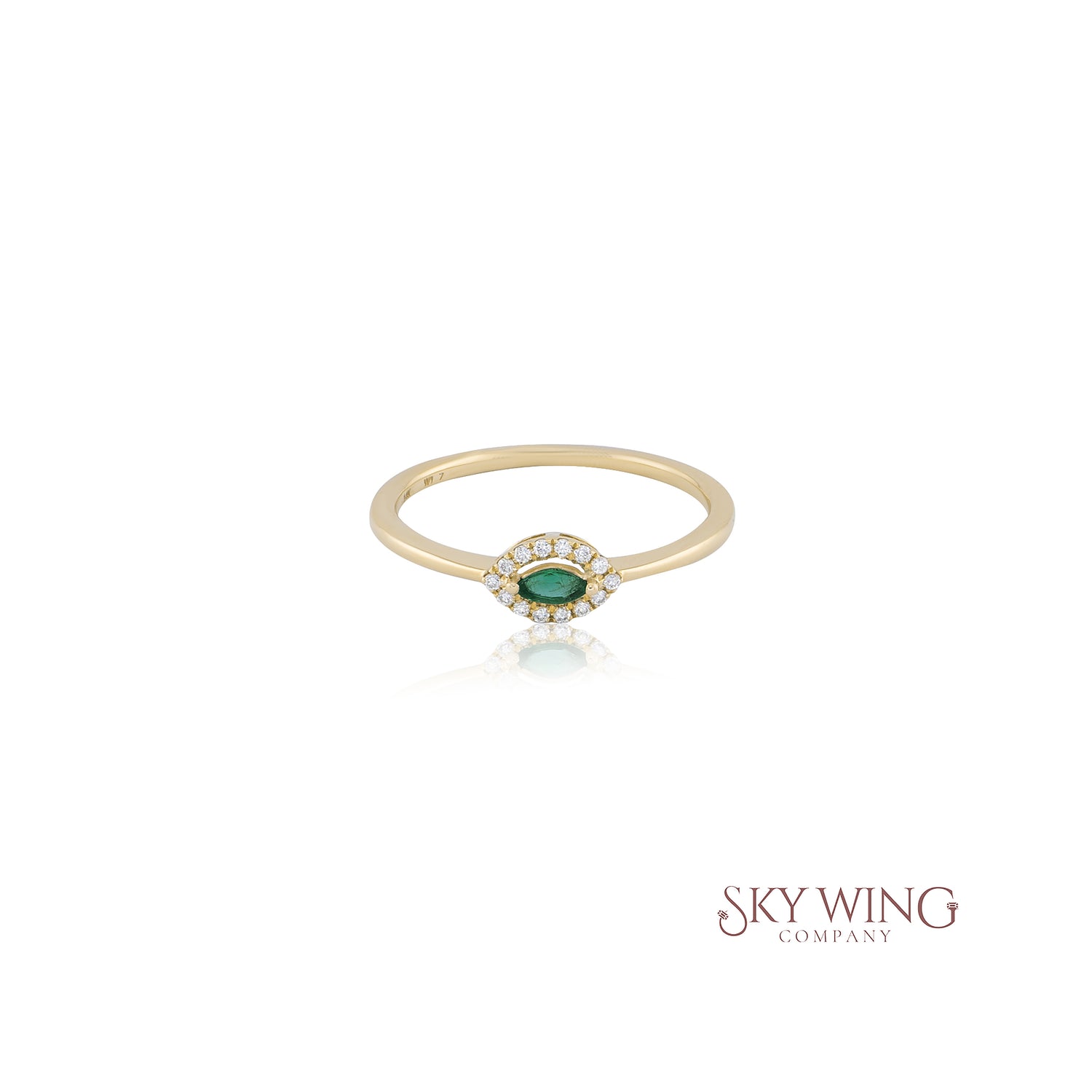 EMERALD MARQUISE AND ROUND DIAMOND RING